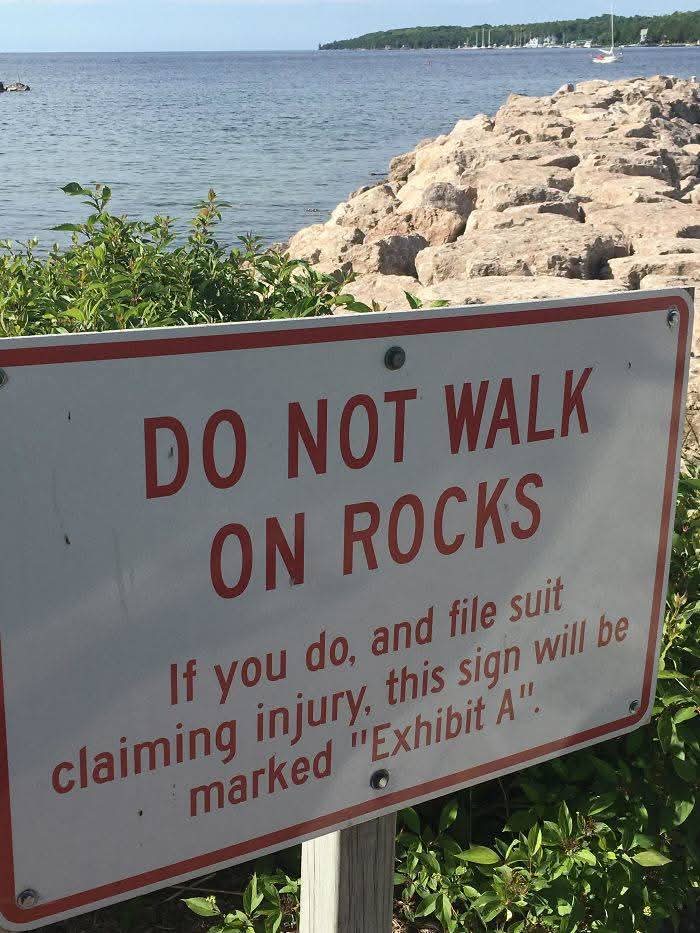 DO NOT WALK ON ROCKS  
If you do, and file suit claiming injury, this sign will be  
marked "Exhibit A".